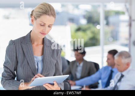 Businesswoman holding tablet Stock Photo