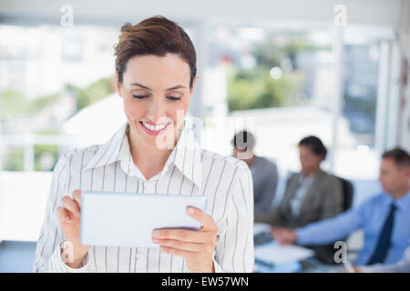 Businesswoman holding tablet Stock Photo