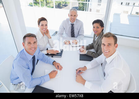 Business team sitting together around the table Stock Photo