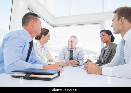 Business team sitting together around the table Stock Photo