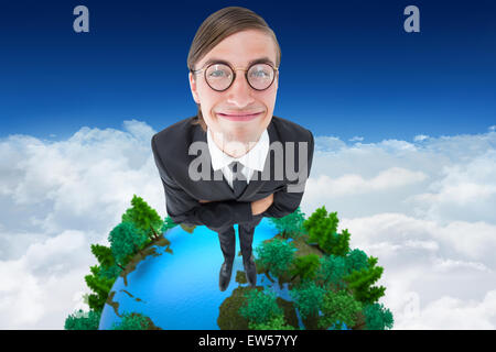 Composite image of geeky businessman smiling at camera Stock Photo