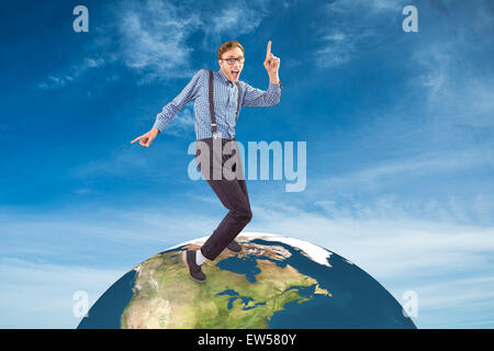 Composite image of geeky hipster dancing to vinyl Stock Photo