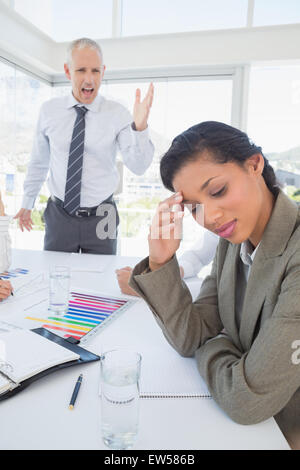Businessman yelling at his colleague Stock Photo