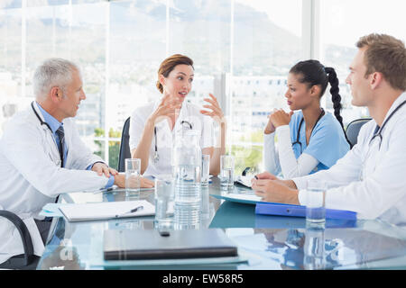 Team of smiling doctors having a meeting Stock Photo