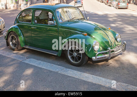 Helsinki, Finland - June 13, 2015: Green early 1966 Volkswagen Beetle car is parked on the street of Helsinki Stock Photo