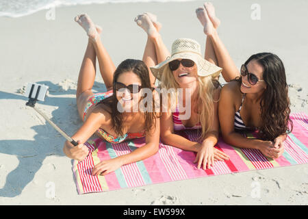 group of friends in swimsuits taking a selfie Stock Photo