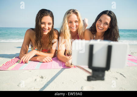 group of friends in swimsuits taking a selfie Stock Photo