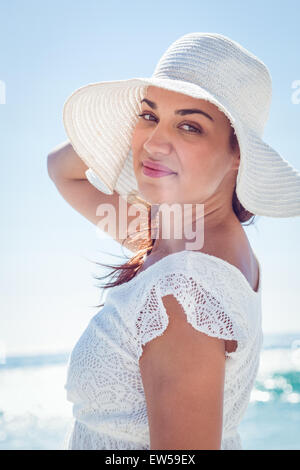 Pretty brunette wearing sunhat and looking at camera Stock Photo