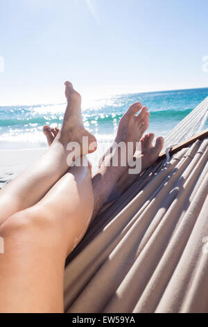 Happy couple napping together in the hammock Stock Photo