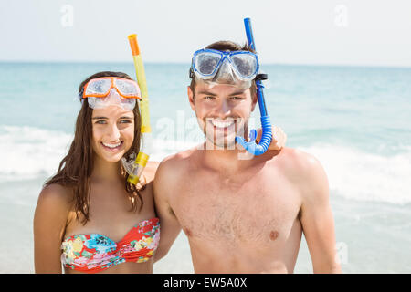 happy couple smiling at camera with mask and snorkel Stock Photo