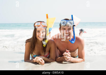 happy couple smiling at camera with mask and snorkel Stock Photo