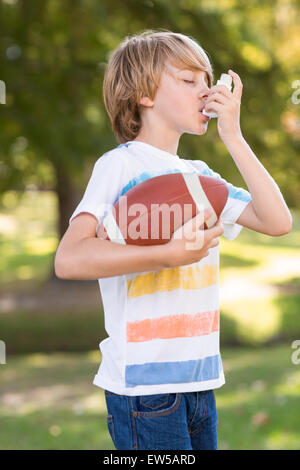 Little boy using his inhaler Stock Photo
