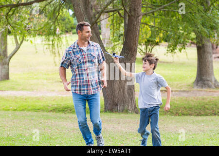 Father and son having fun in the park Stock Photo