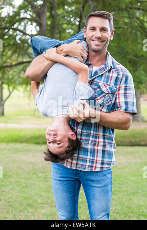 Father and son having fun in the park Stock Photo