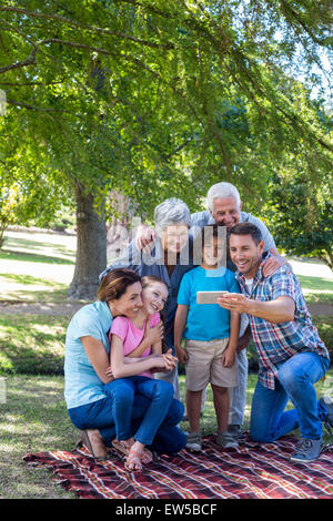 Extended family taking a selfie in the park Stock Photo
