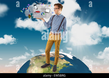 Composite image of geeky businessman showing his laptop Stock Photo