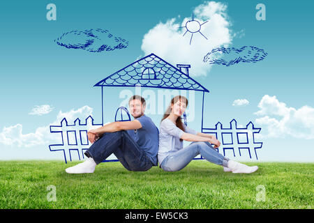 Composite image of couple both sitting on floor Stock Photo