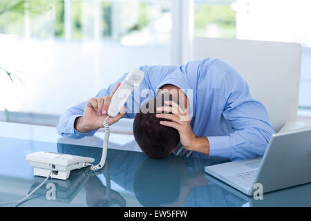 Depressed businessman on the phone Stock Photo