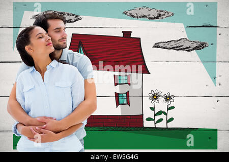 Composite image of cute couple embracing with eyes closed Stock Photo