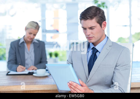 Serious businessman reading a file Stock Photo