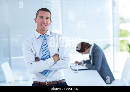Smiling businessman looking at camera Stock Photo