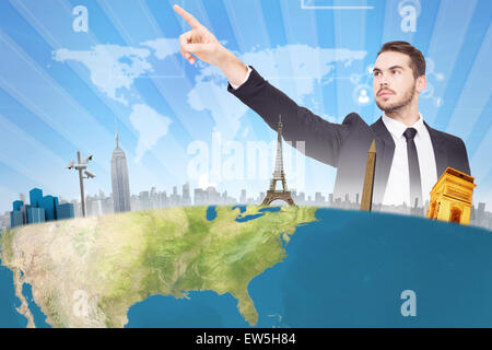 Composite image of thoughtful businessman pointing his finger Stock Photo