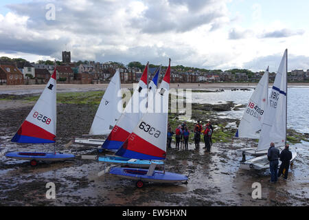 Sailing dinghies launching from beach Stock Photo