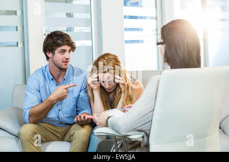 Psychologist helping a couple with relationship difficulties Stock Photo