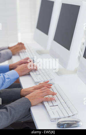 Business team working on computers Stock Photo