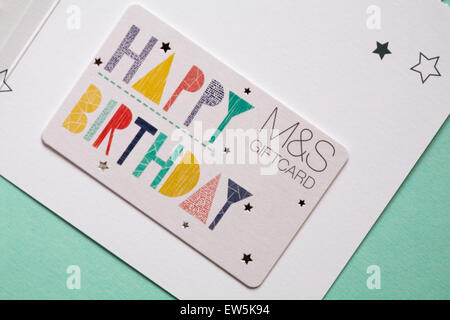 M&S Happy Birthday giftcard gift card set on pale blue green background Stock Photo