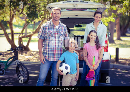 Happy family going for a camping in the park Stock Photo