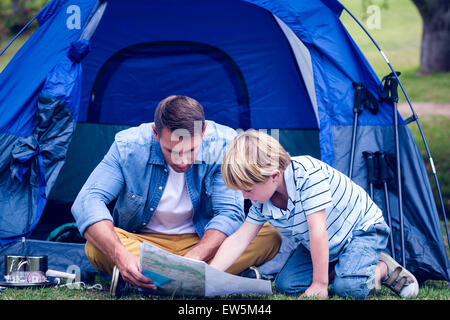 Father and son camping in the park Stock Photo