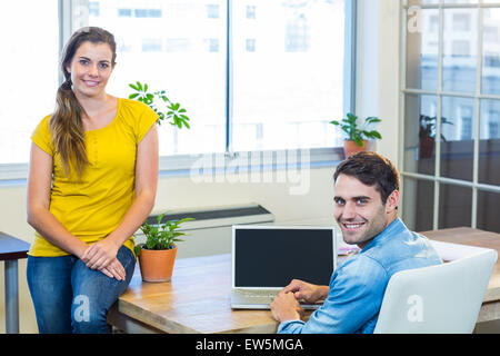 Casual business partners smiling at camera Stock Photo