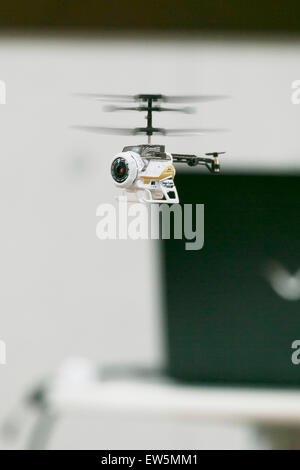 Tokyo, Japan. 18th June, 2015. A helicopter ''Nano Falco Digi Cam'' performs during the International Tokyo Toy Show 2015 in Tokyo Big Sight on June 18, 2015, Tokyo, Japan. Japan's largest trade show for toy makers attracts buyers and collectors by introducing the latest products from different toymakers from Japan and overseas. The toy fair showcases about 35,000 toys from 149 domestic and foreign companies and is held over four days. Credit:  Rodrigo Reyes Marin/AFLO/Alamy Live News Stock Photo