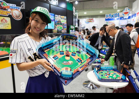 Tokyo, Japan. 18th June, 2015. An exhibitor shows a ''3D Yakyuban'' baseball table game at the International Tokyo Toy Show 2015 in Tokyo Big Sight on June 18, 2015, Tokyo, Japan. Japan's largest trade show for toy makers attracts buyers and collectors by introducing the latest products from different toymakers from Japan and overseas. The toy fair showcases about 35,000 toys from 149 domestic and foreign companies and is held over four days. Credit:  Rodrigo Reyes Marin/AFLO/Alamy Live News Stock Photo