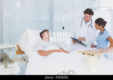 Doctors taking care of patient Stock Photo