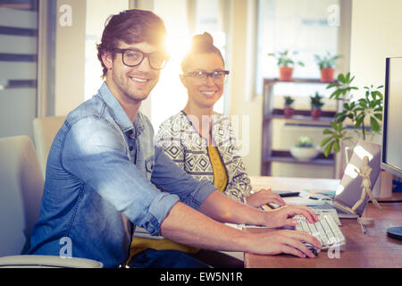 Happy designers working together Stock Photo
