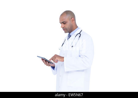 Serious doctor using tablet Stock Photo