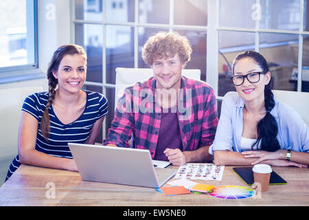 Happy designers smiling at camera Stock Photo