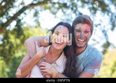Happy friends covered in powder paint Stock Photo