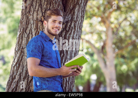Young man reading a book Stock Photo