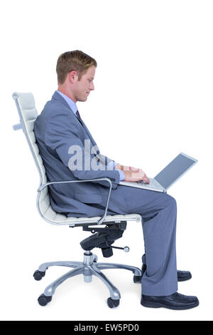 Handsome businessman using his laptop Stock Photo