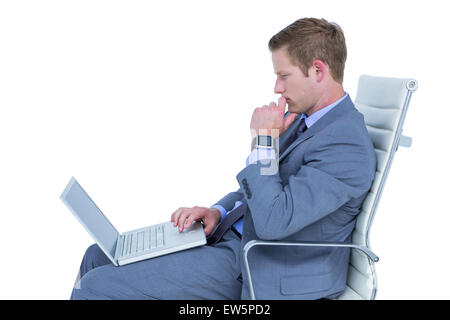 Handsome businessman using his laptop Stock Photo