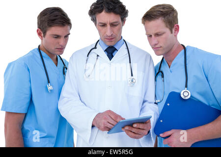 Doctors and nurses using laptop Stock Photo