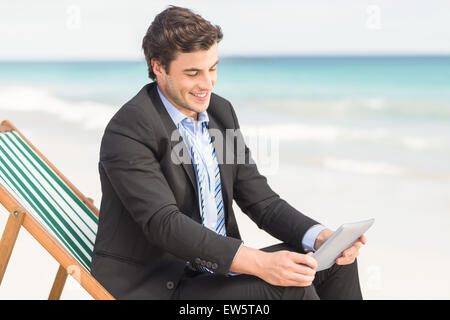 Businessman using his tablet pc Stock Photo