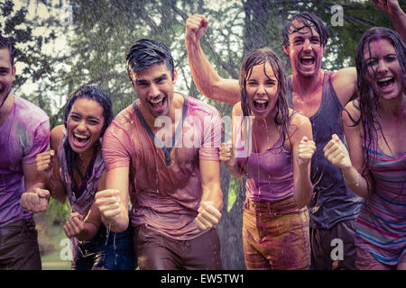 Happy friends covered in powder paint Stock Photo