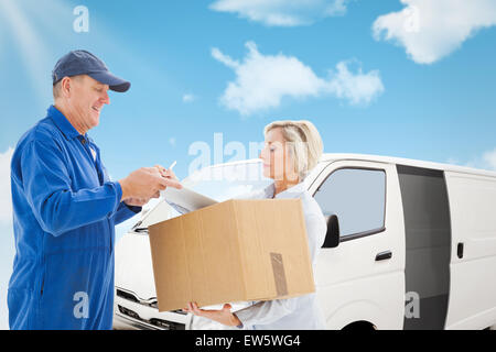 Composite image of happy delivery man with customer Stock Photo