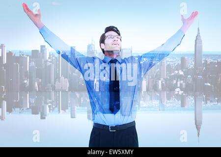 Composite image of cheering businessman with his arms raised up Stock Photo