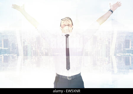 Composite image of cheering businessman with his arms raised up Stock Photo