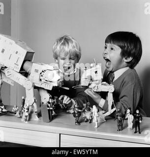 Two boys, Thomas (dark hair) and Robbin playing with their Star Wars toys. 16th November 1983. Stock Photo